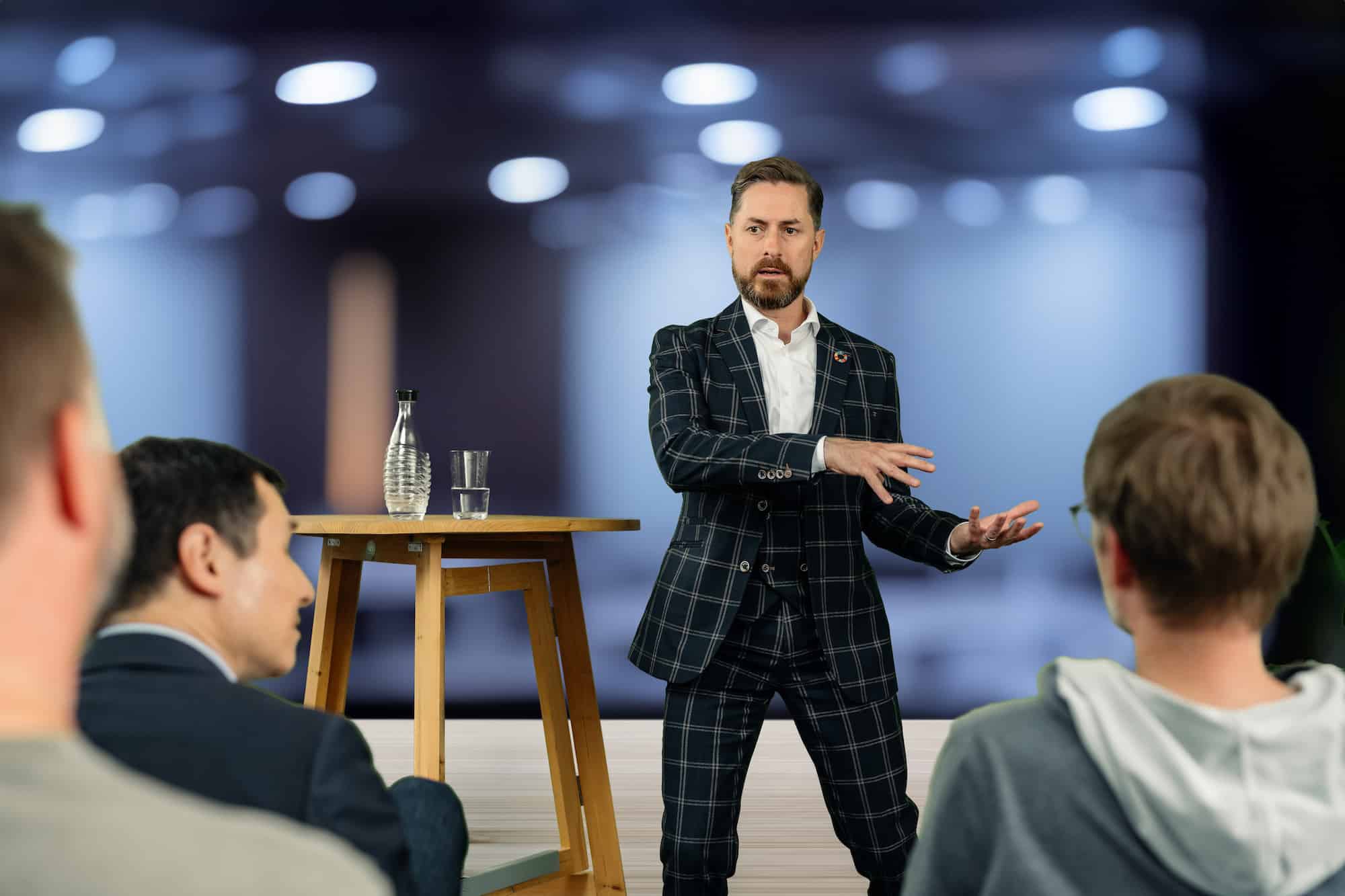 Rainer on stage in front of an audience